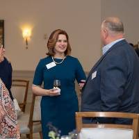 Foundation Director Laura Aikens talking with event guests